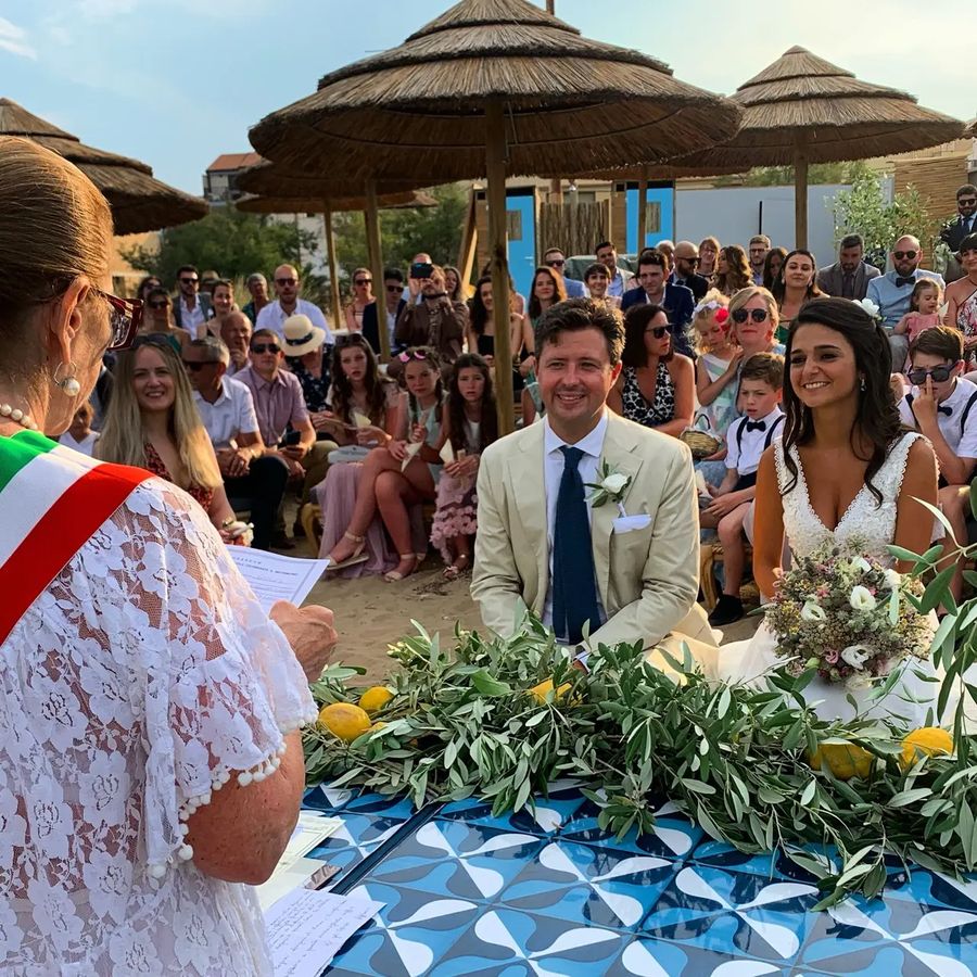 A ceremony set up on the sand at Blasé, Marzamemi, looking out to the Isolotto Brancati