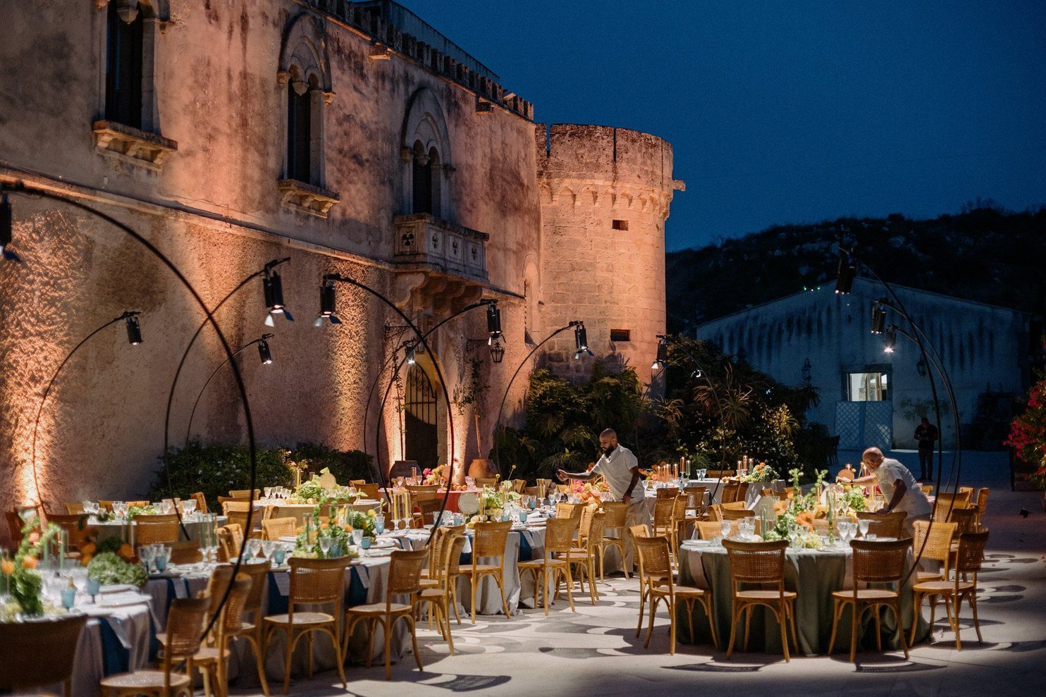 The Castello del Solacium outside Siracusa lit for a wedding dinner in the evening, in a photograph from the castle