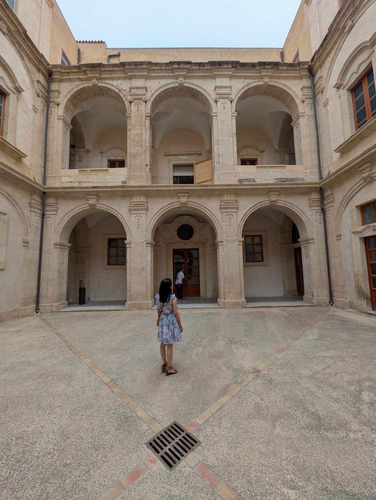 The two-tier arcaded courtyard of the ex Liceo Tommaso Gargallo, open to the sky