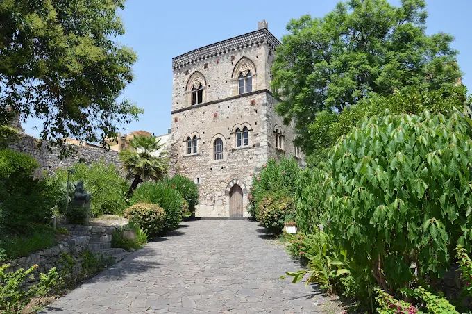 The fourteenth-century Palazzo dei Duchi di Santo Stefano in Taormina, dark lava stone and pale limestone